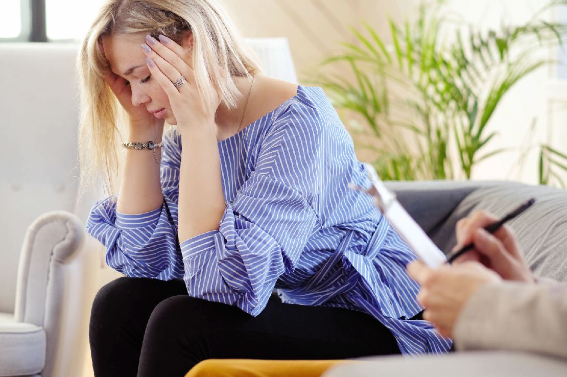 Woman speaking with a therapist during an individual therapy session